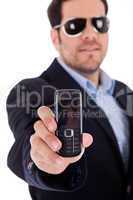 Business man wearing sunglasses and showing a Nokia mobile