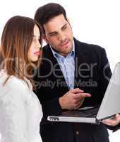 Business people discussing with laptop