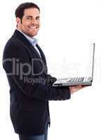 Young professional smiling with a laptop in his hand