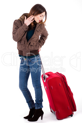 Women ready for travel and looking her luggage