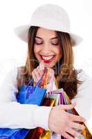 Closeup of women holding her shopping bags very happily