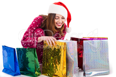 Santa girl looking into the shopping bags