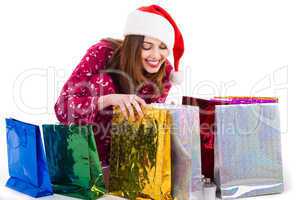 Santa girl looking into the shopping bags
