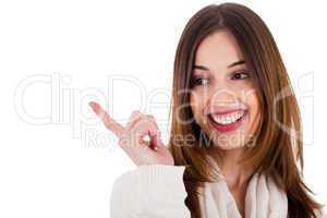 attractive female model smiling and pointing her finger at copy