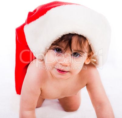 baby in santa hat crawling