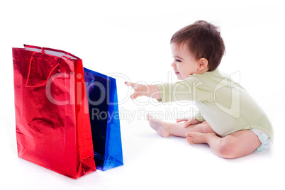 Baby trying to pull the shopping bag