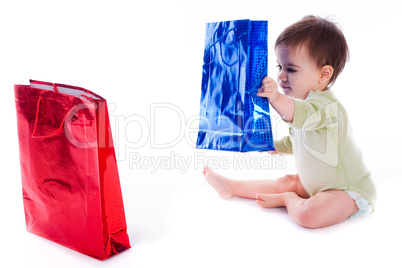 Baby holding the shopping bag