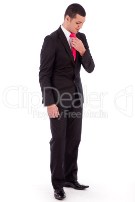 Business man bending his head down to fit his necktie