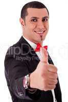 Business man showing his success with thumbs up