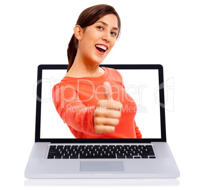 Young girl showing thumbs up getsure through laptop screen