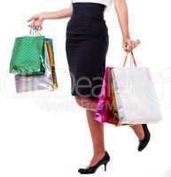 Woman holding shopping bags half length shot