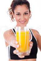 fitness girl showing a fresh juice,focus on girl