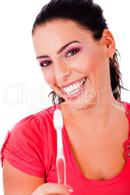 beautiful young woman holding tooth brush and smiling