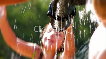 A young child plays in the water.