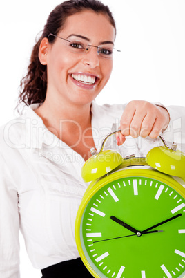 Young happy woman carrying a old clock