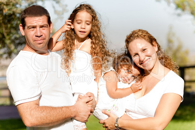 Caucasian happy family in the park