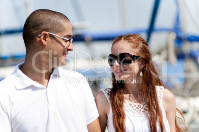 Couple looking each other at the harbour