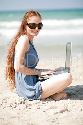 Portrait of a woman working with laptop