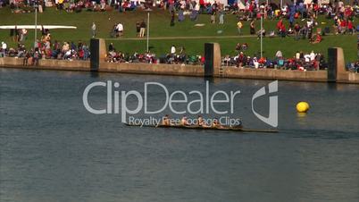 Crew team members prepare and race in the Row Regatta on the Allegheny River on Pittsburgh's north shore.