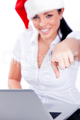 Young santa woman pointing at the camera