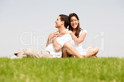 Happy young women with arms around her husband