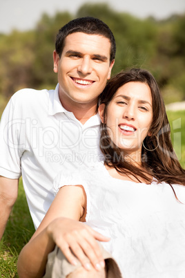 Portrait of Happy young couple sitting and smiling