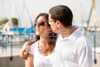 Portrait of young happy couple at the harbour