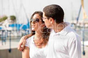 Portrait of young happy couple at the harbour