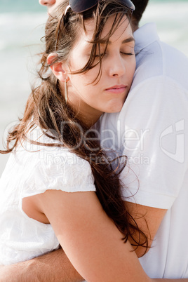 young pretty woman relaxing on her husband shoulders