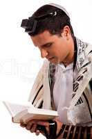 Close up of a young  jewish man with book