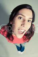 close-up of a cheerful young woman looking up top view