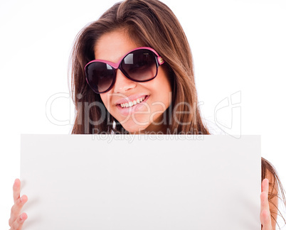 closeup of beautiful young women showing blank board and smiling