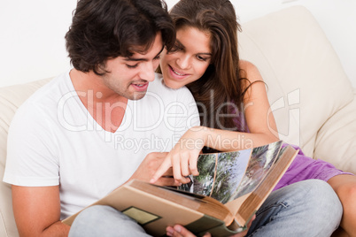 closeup of beautiful young women showing blank board and smiling