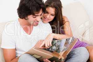 closeup of beautiful young women showing blank board and smiling