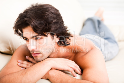young man imagine by laying on the sofa