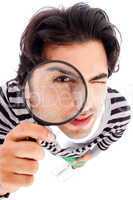 young man looking up with a magnifying glass