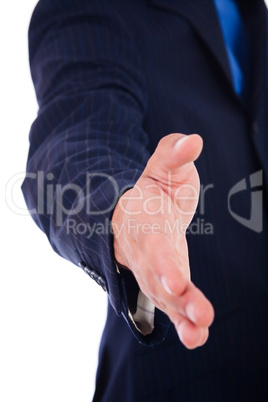 business man welcoming you with an open hand ready to shake