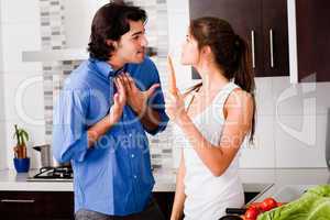 young couple argue themself in the kitchen
