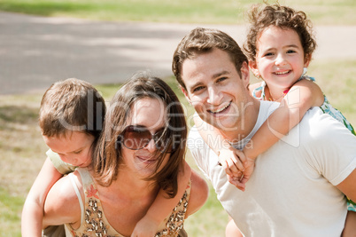 parents biggyback their children