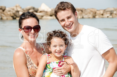 Family of three on the beach