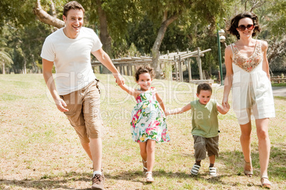 Family running with two young children