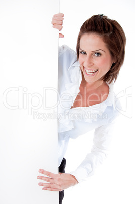 woman laughing by a blank board
