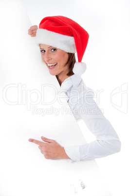 Female Santa pointing down at blank billboard