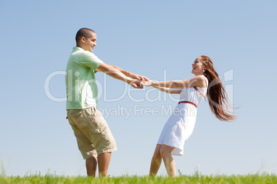young couple play at park