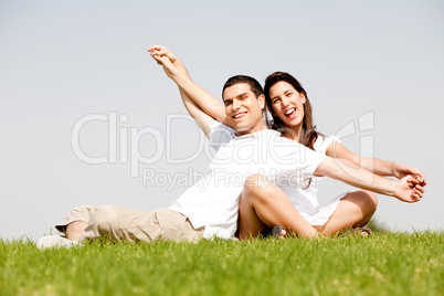 Young Couple Sitting Together Outside