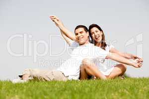 Young Couple Sitting Together Outside