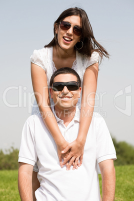 young Couple Sitting Together Outside