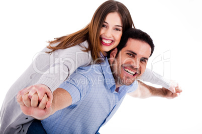 Young woman enjoying piggyback ride