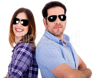 stylish couple posing back to back