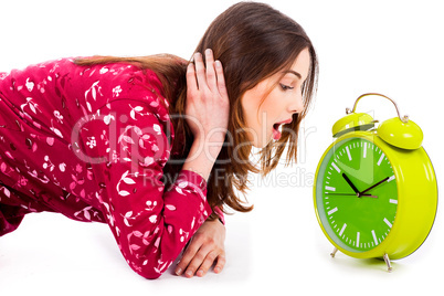 lady looking at alarm clock